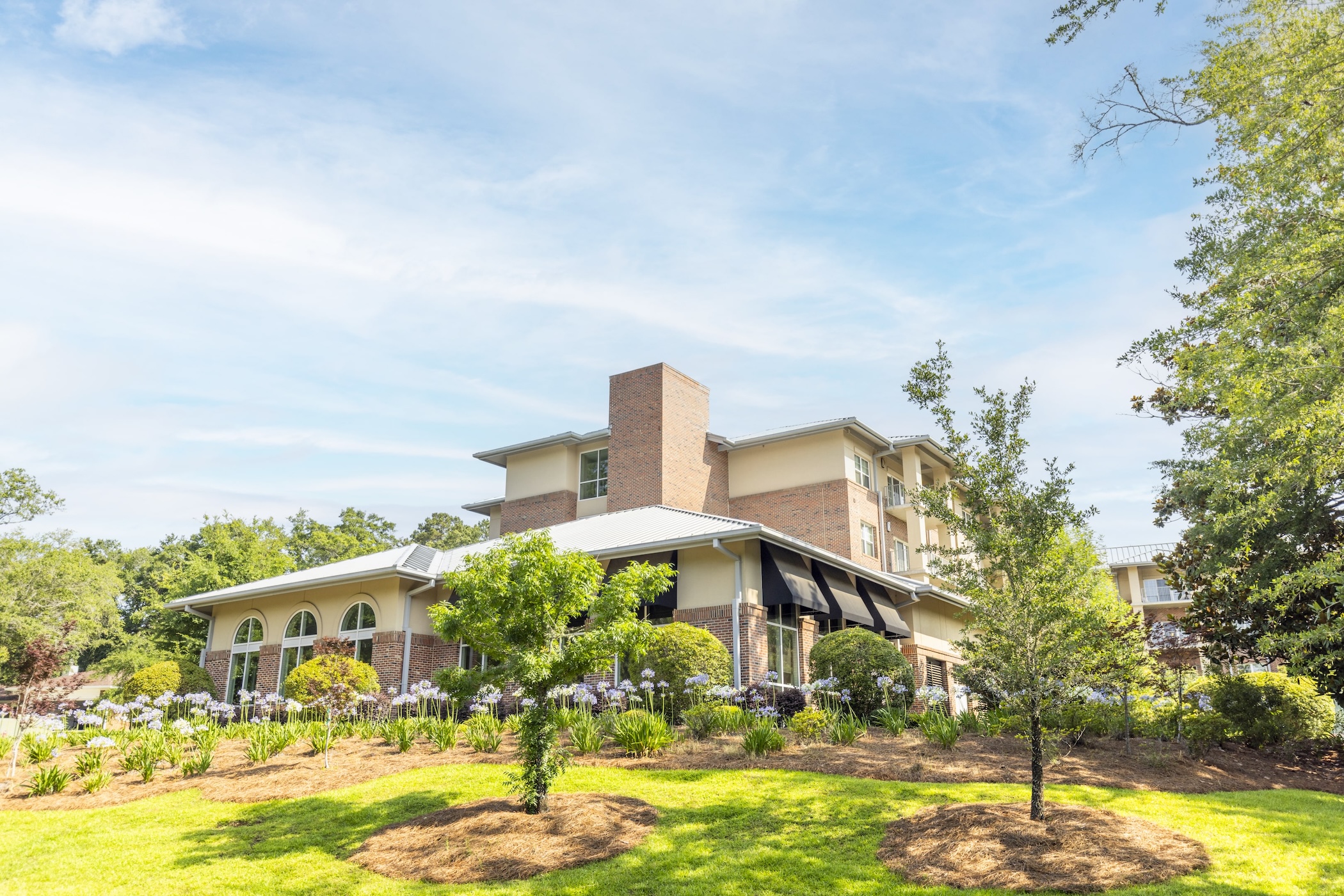 Exterior view of Westminster Towers facility with landscaping