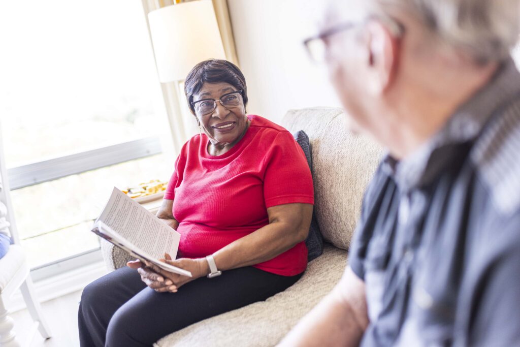 Residents engaging in a warm conversation indoors