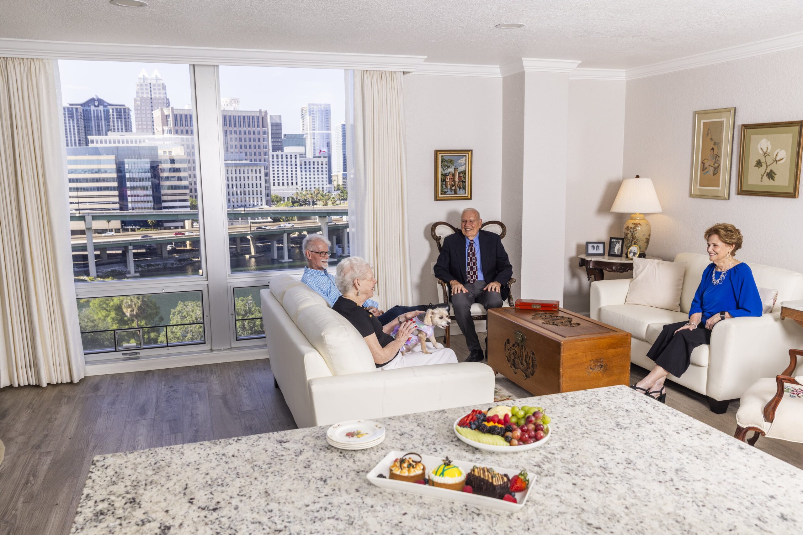 Residents enjoying conversation in a cheerful common area
