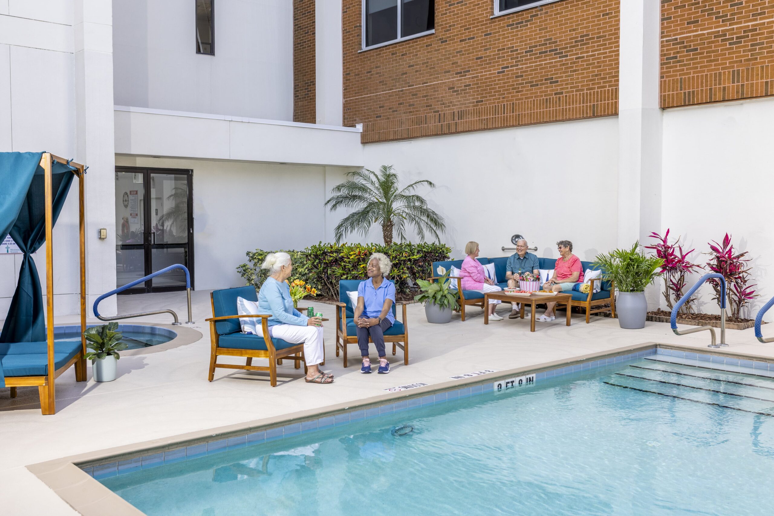 Residents enjoying the outdoor pool area
