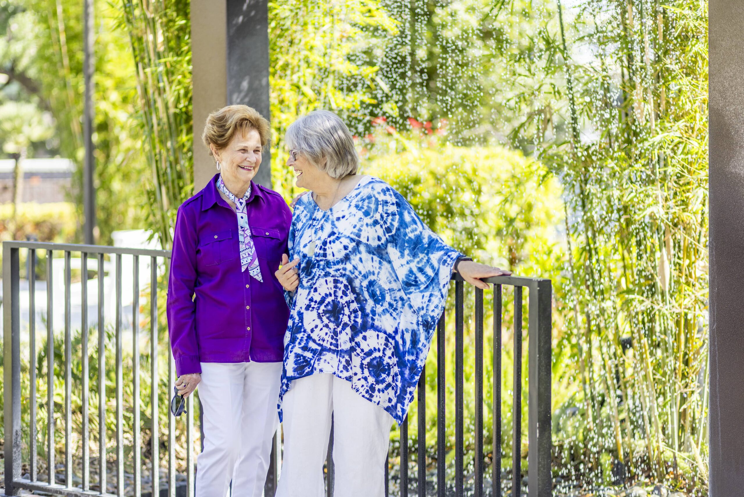 Two residents enjoying conversation in a garden