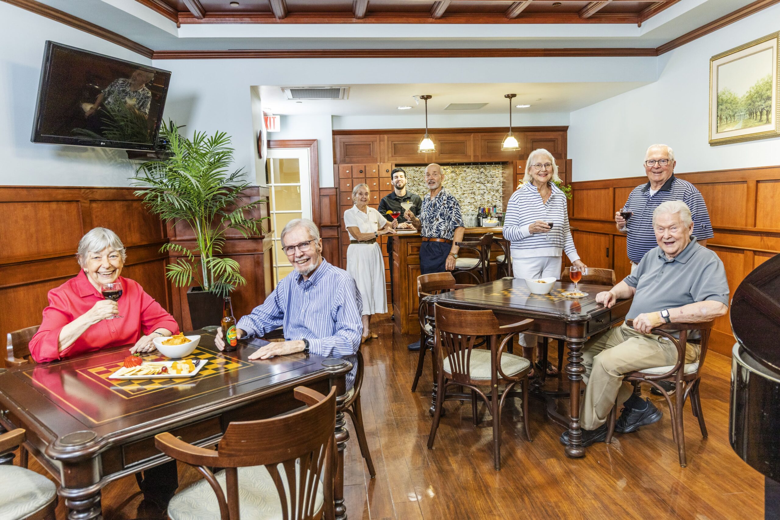 Residents enjoying drinks and snacks in a common area