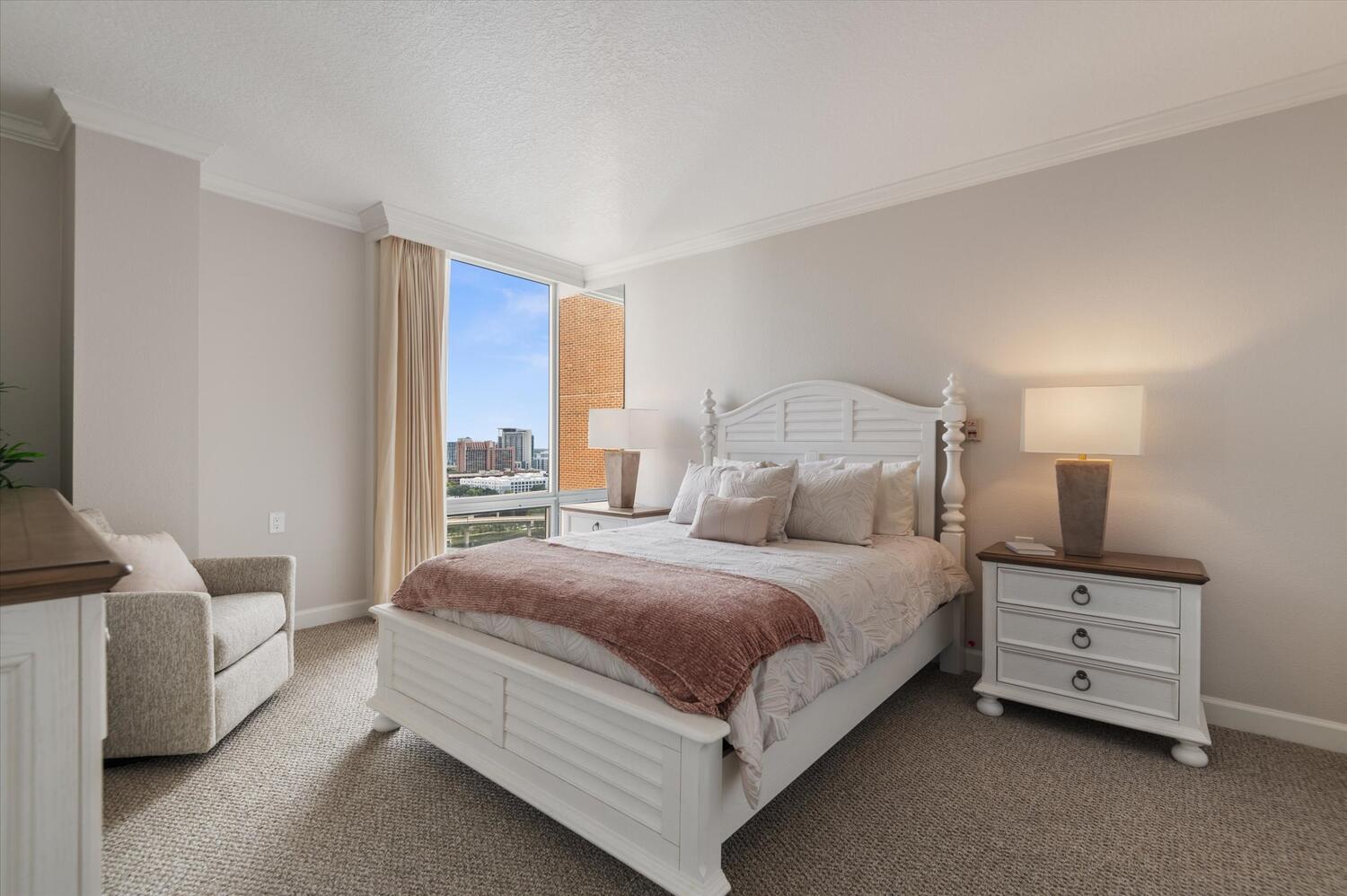 Bright, comfortable resident bedroom with city view