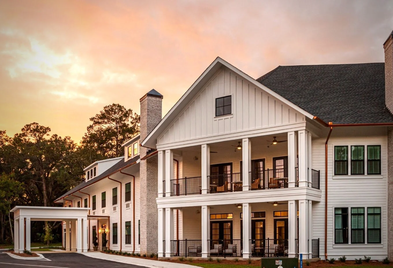 Exterior view of The Residence at Oak Grove at sunset