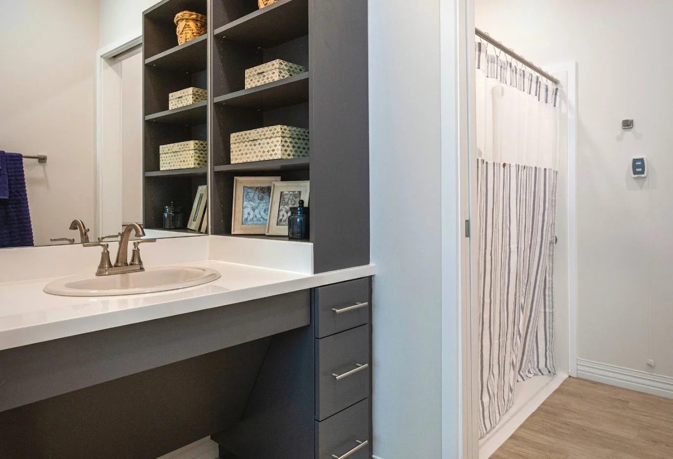 Modern bathroom with vanity and storage shelves
