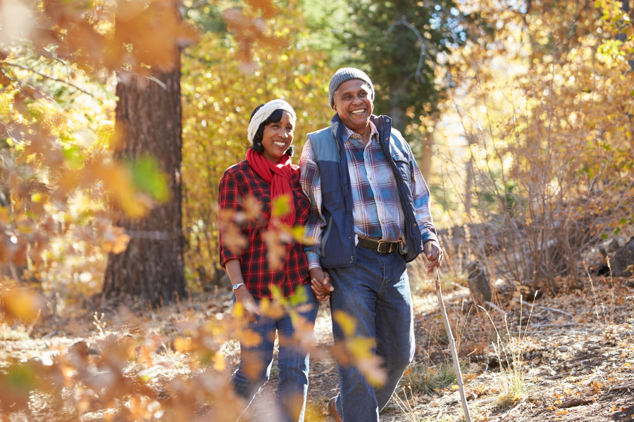 Two residents enjoying a walk in a forested area