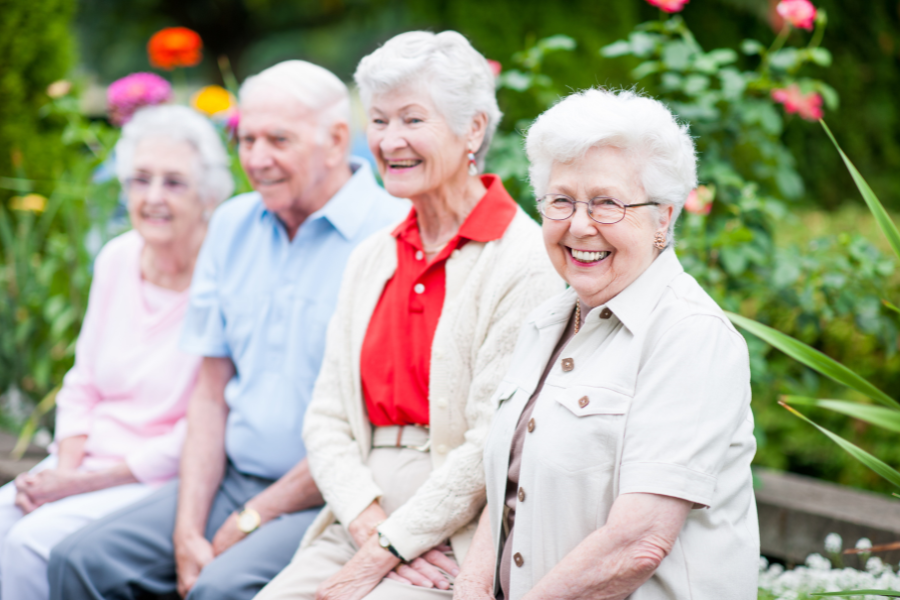 Seniors enjoying a sunny day in a garden