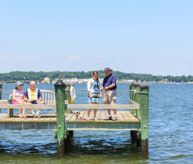 Residents enjoying time on a dock by the water