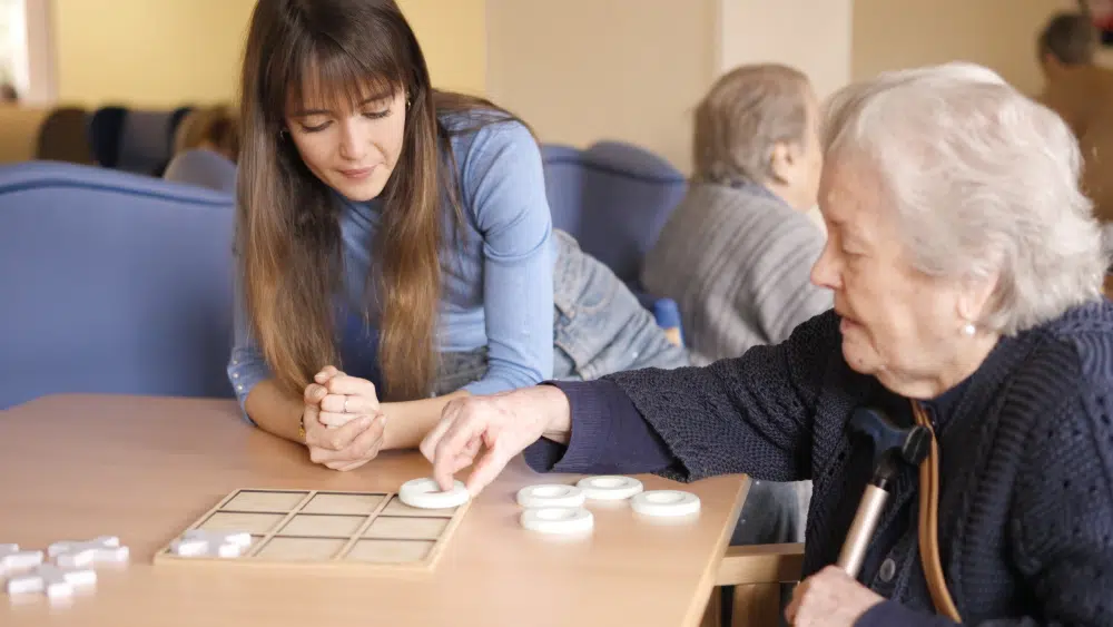 Residents engaging in a board game activity