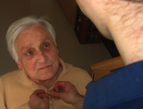 Close-up of a caregiver assisting an elderly resident
