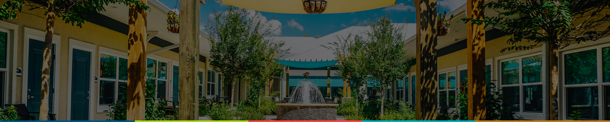 Outdoor courtyard with fountain and trees