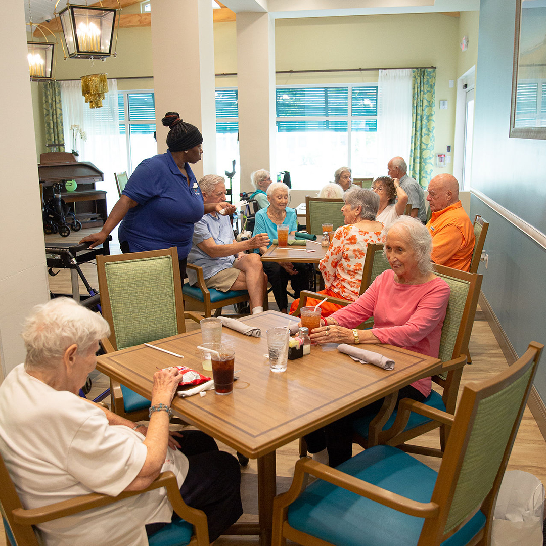 Residents enjoying a meal in the dining room