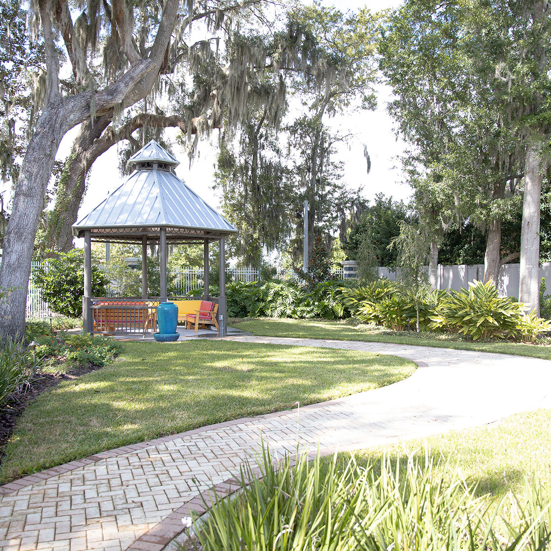 Garden gazebo surrounded by lush landscaping