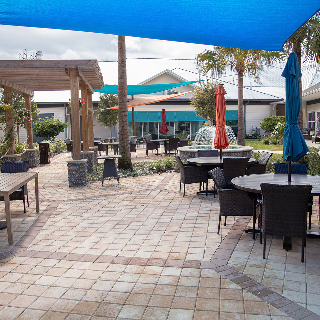 Outdoor patio area with seating and umbrellas