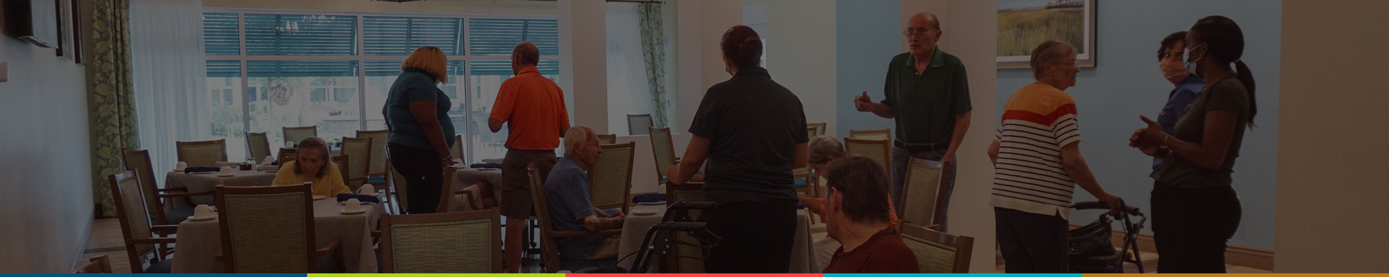 Residents and staff interacting in a common area