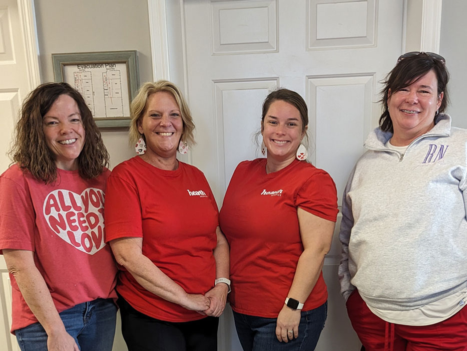 Staff members smiling together in the facility.