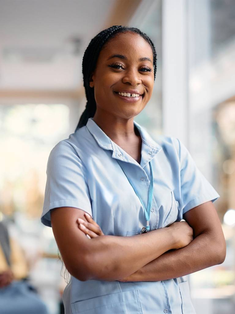 Smiling staff member in a care facility.