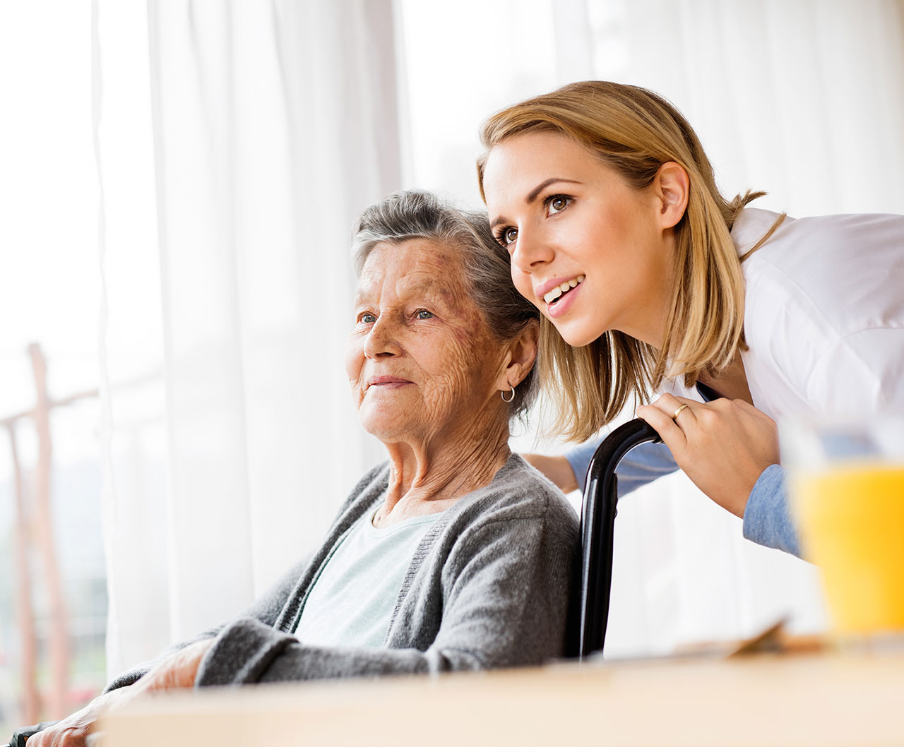Staff member engaging with elderly resident
