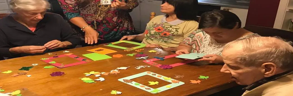 Residents engaging in a craft activity together.