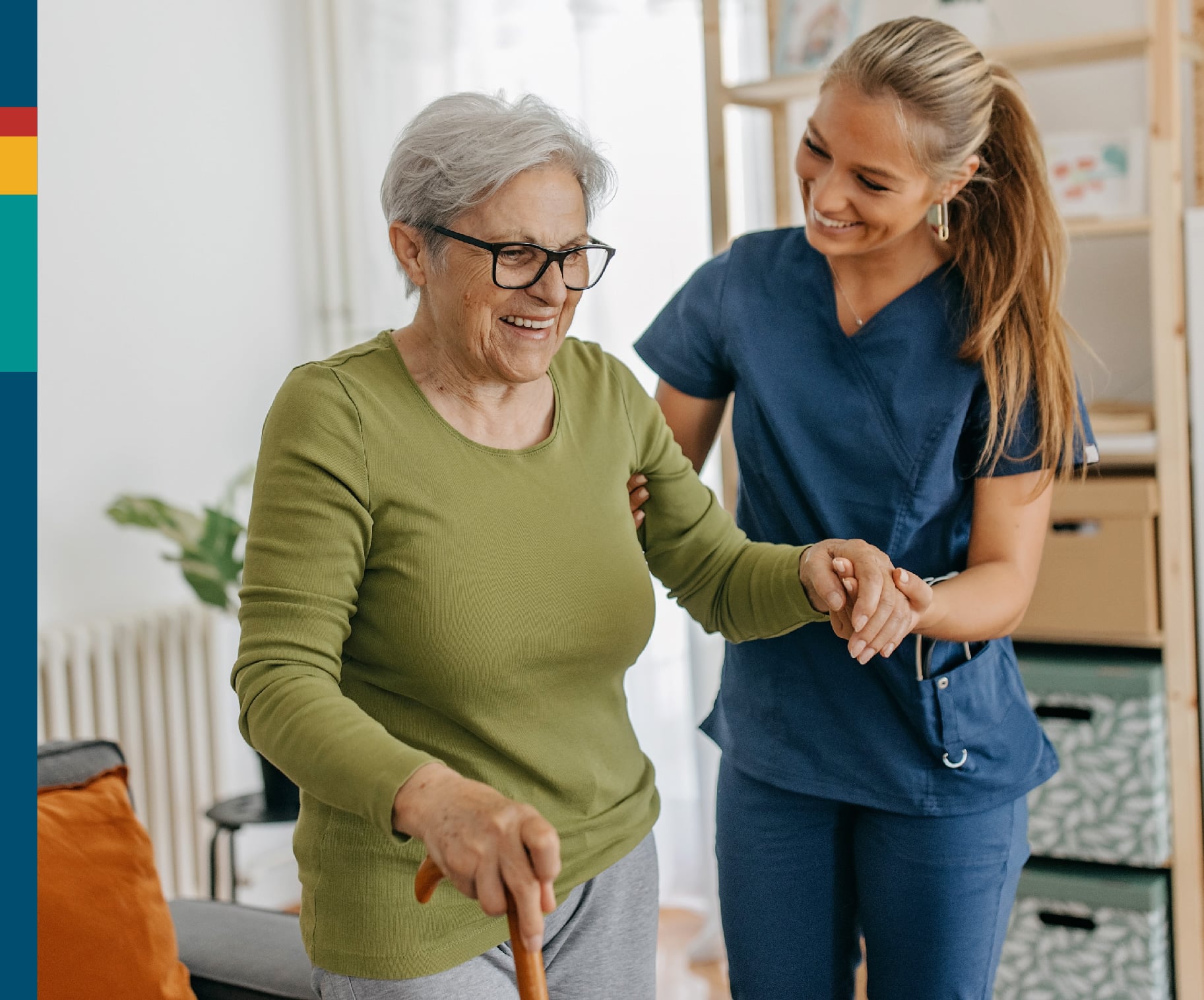 Caregiver assisting an elderly woman indoors