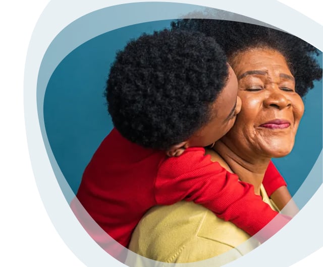 Happy elder woman with child smiling together