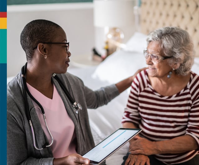 Nurse interacting with a senior resident.