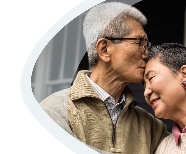 Elderly couple sharing a tender moment