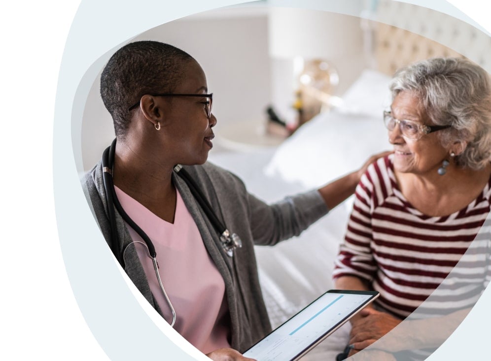 A caregiver interacting with an elderly resident.