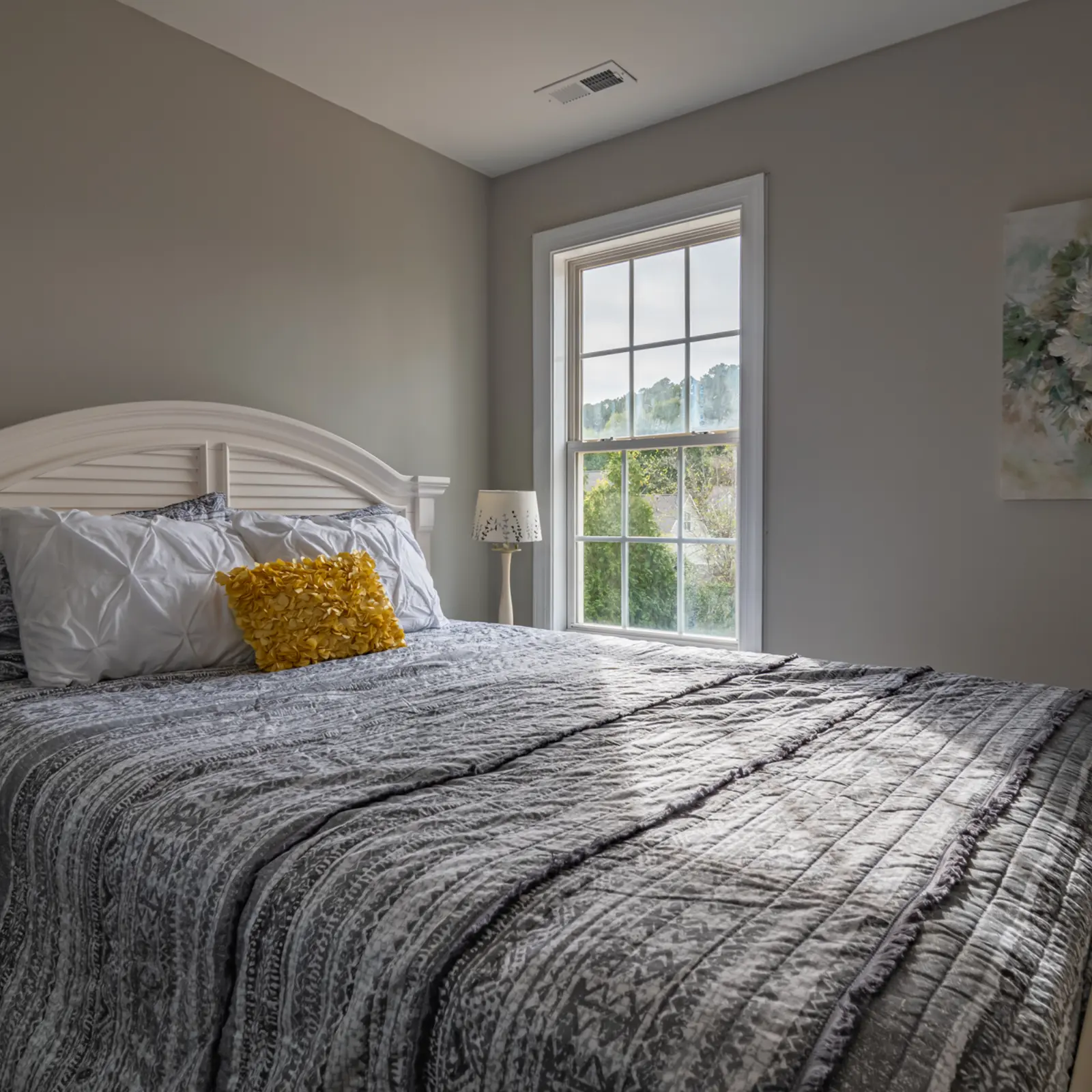 Cozy bedroom with a bed and window view