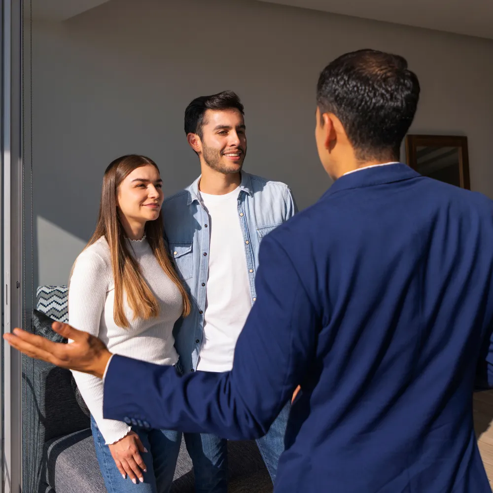 A conversation between three adults indoors