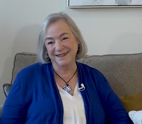 Resident smiling in a cozy indoor setting