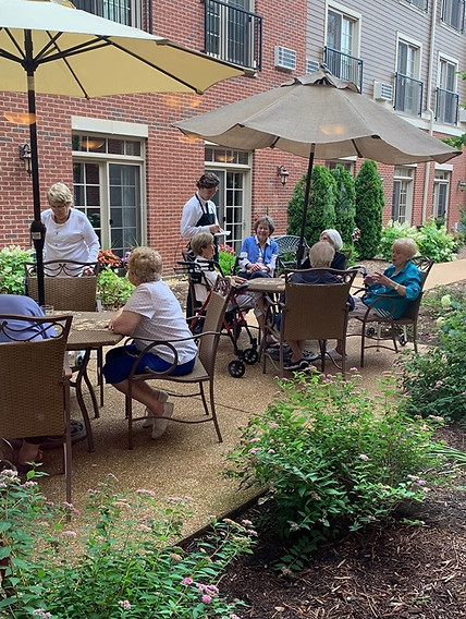 Residents enjoying a social activity in the garden
