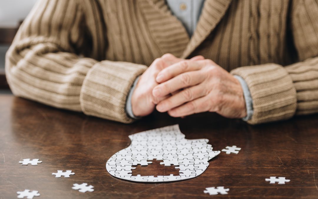 A resident working on a puzzle at a table