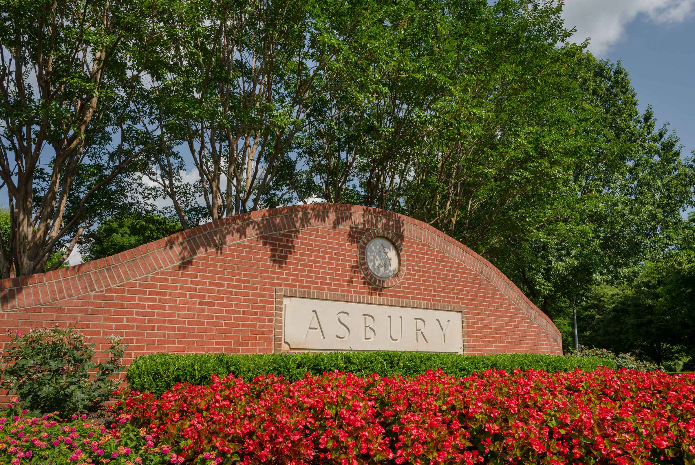 Exterior view of the Asbury entrance with flowers