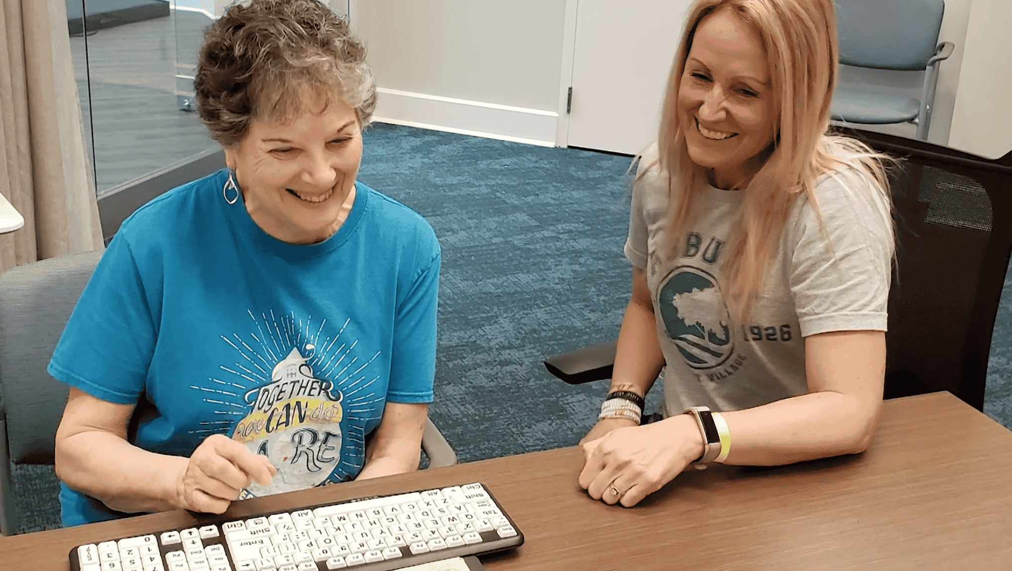 Resident and staff member engaged in an activity