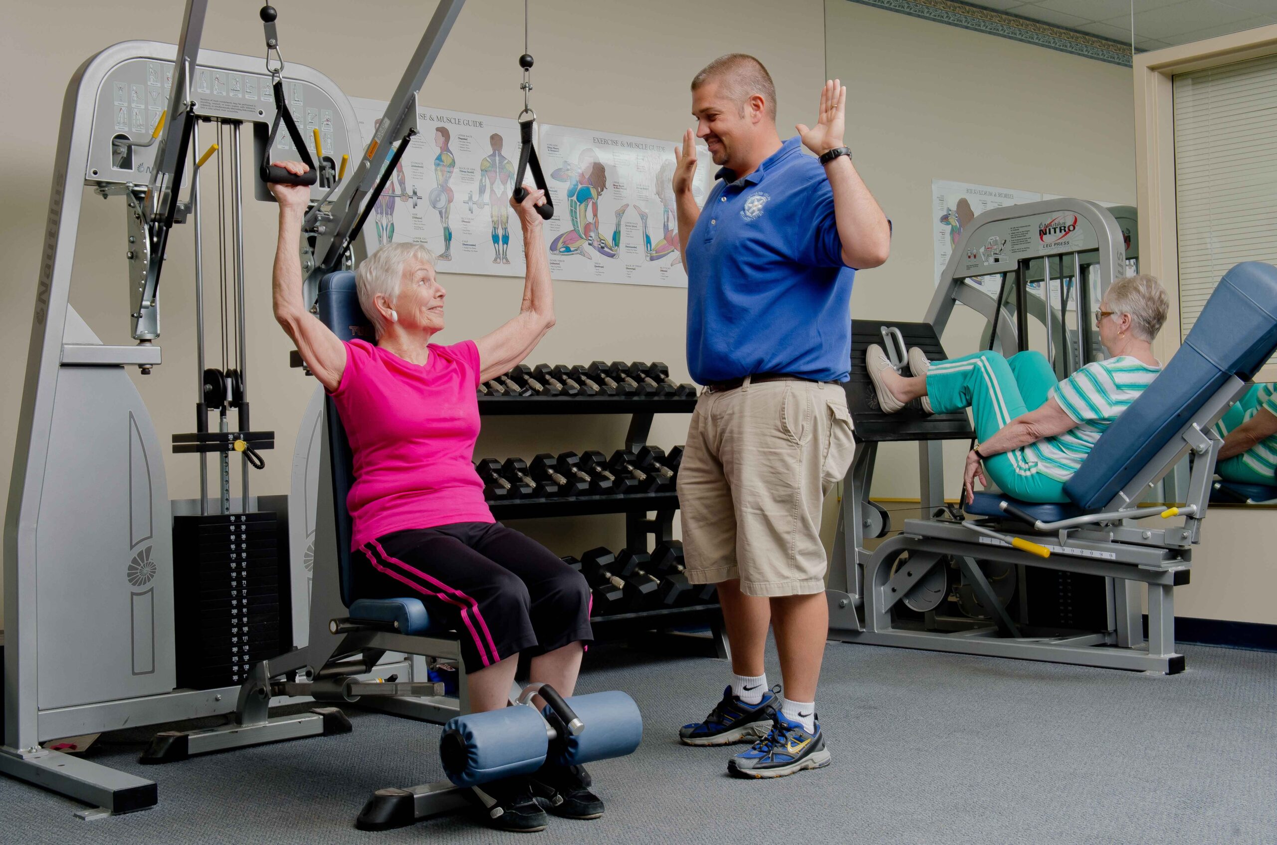 Residents engaging in exercise with staff support