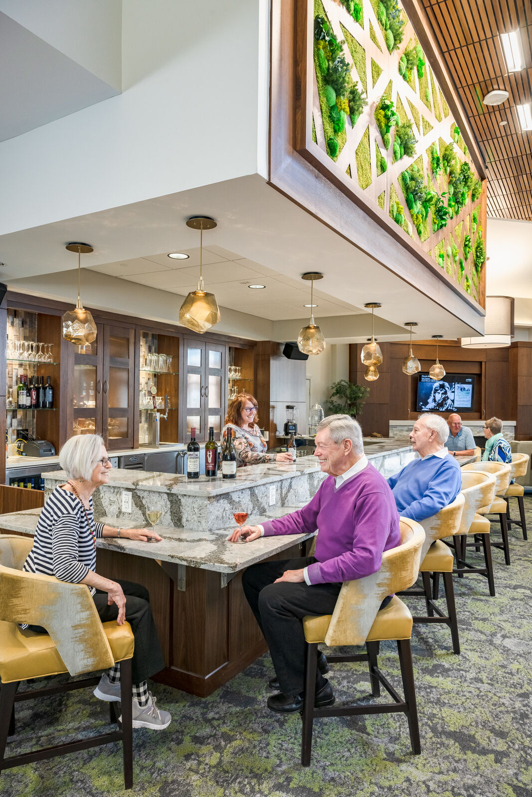 Residents enjoying drinks at the bar area