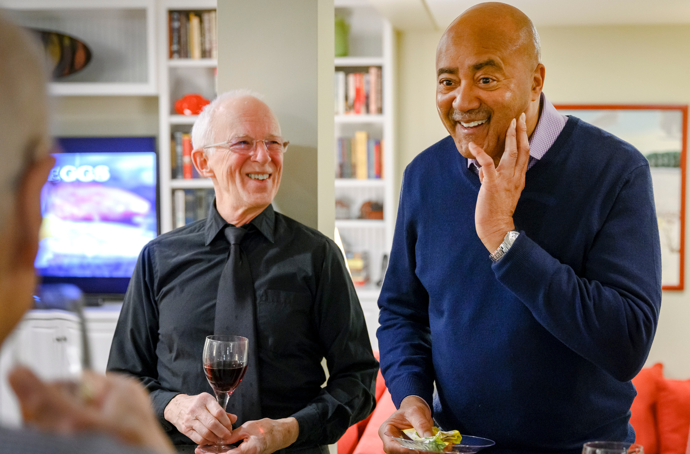 Two residents enjoying conversation at a social gathering