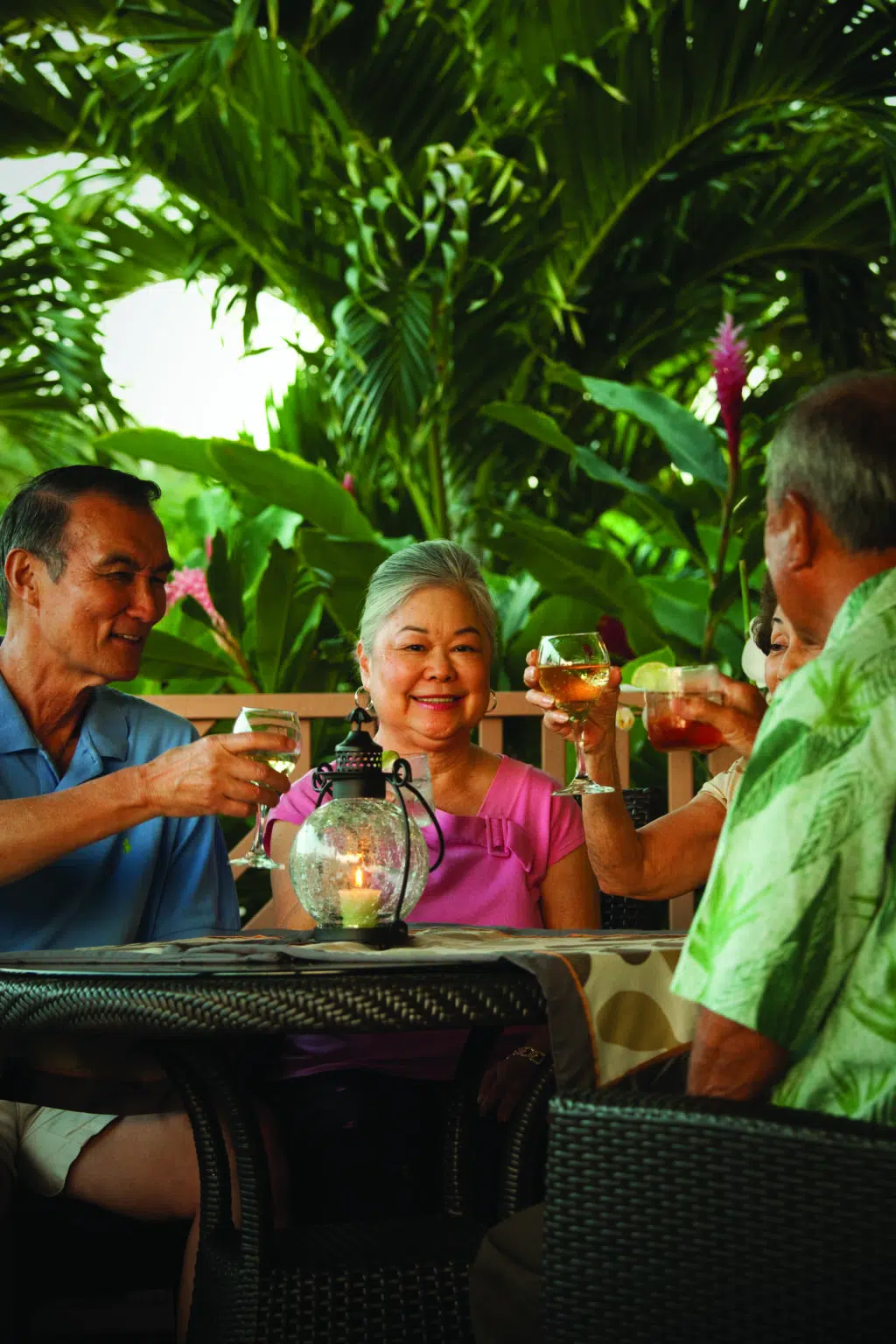 Residents enjoying drinks in a lush outdoor setting