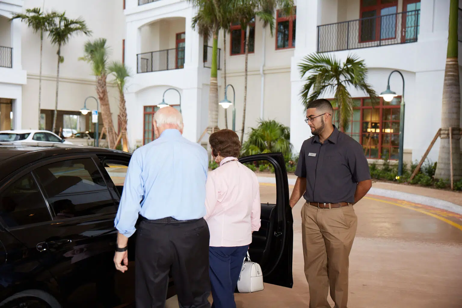 Staff assisting residents in a common area