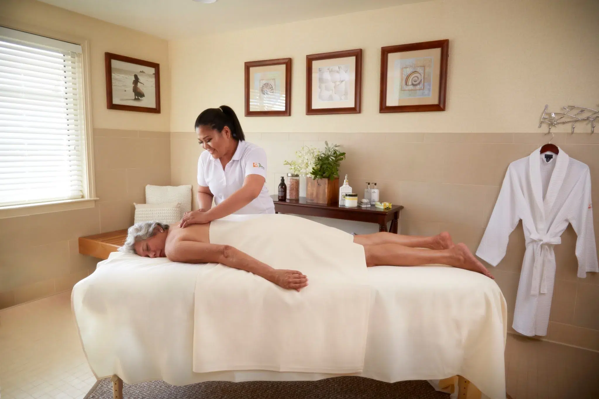 Resident receiving a massage in a serene spa room