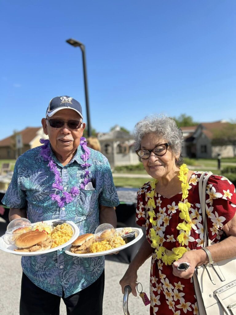 Residents enjoying a meal outside during an event