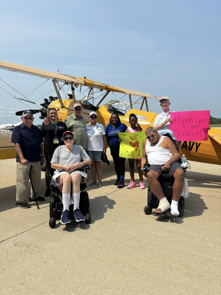 Residents and staff celebrating a special event outdoors