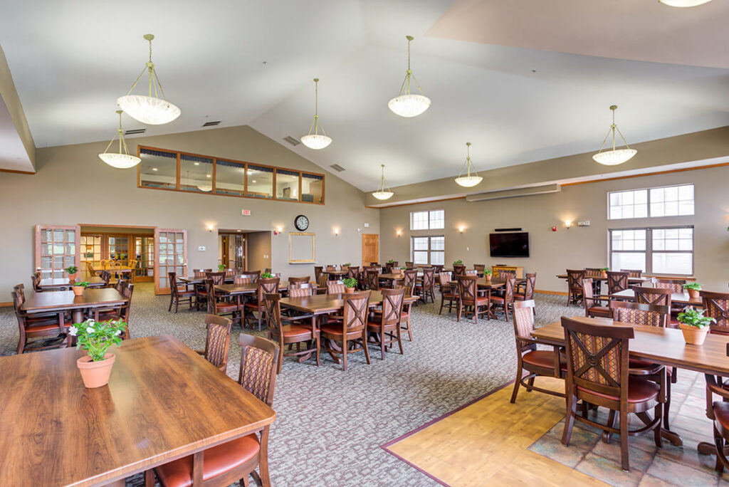 Common area with dining tables and plants