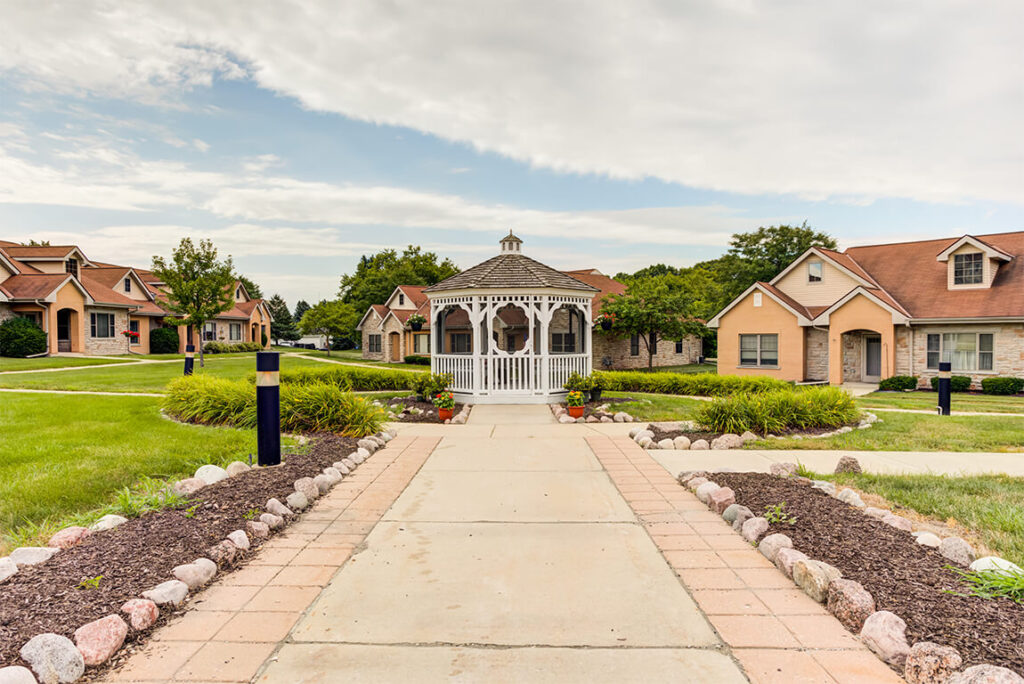 Pathway leading to a gazebo in a landscaped area