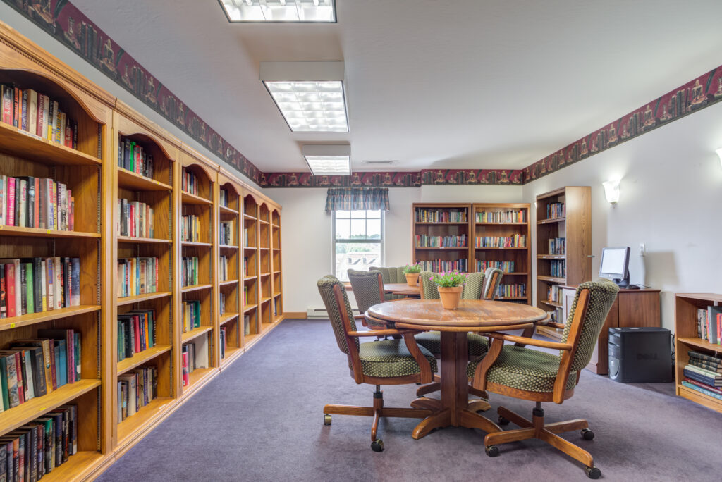 Bright, inviting library with shelves and seating