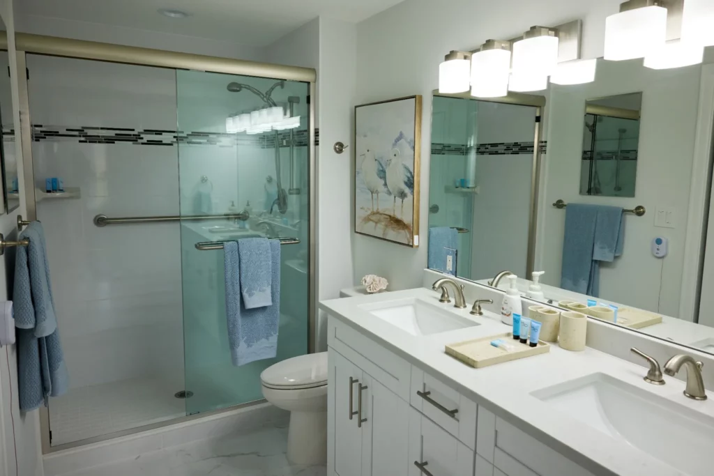 Modern bathroom with double sink and shower