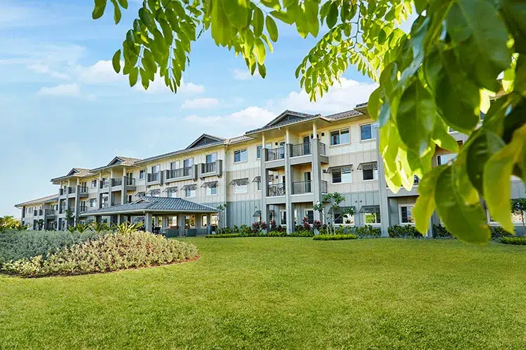 Exterior view of the facility with landscaped gardens