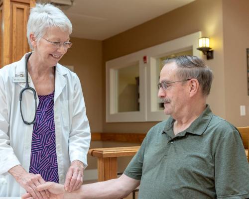 Staff member interacting with a resident in the facility