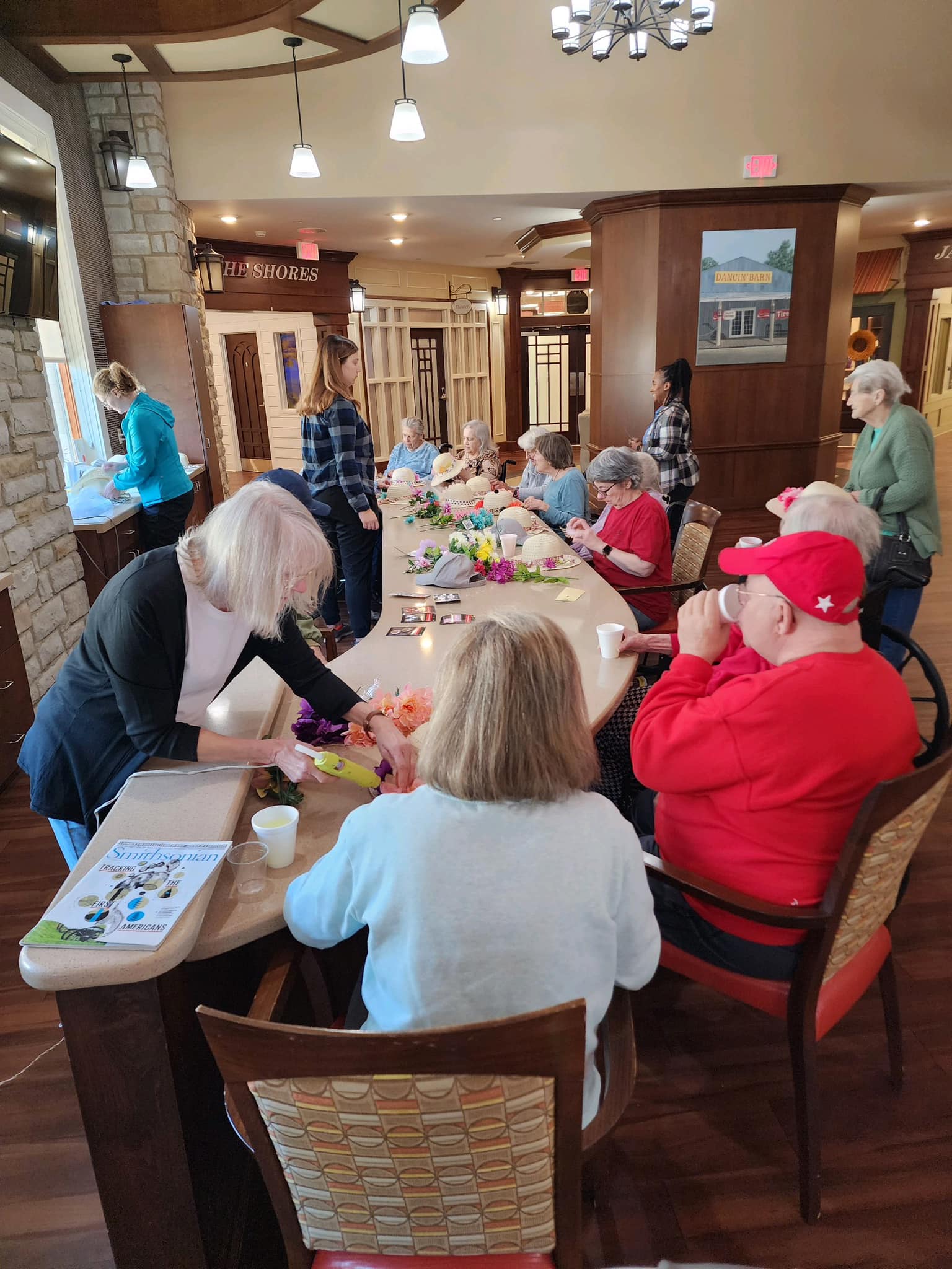 Residents participating in a floral arrangement activity.